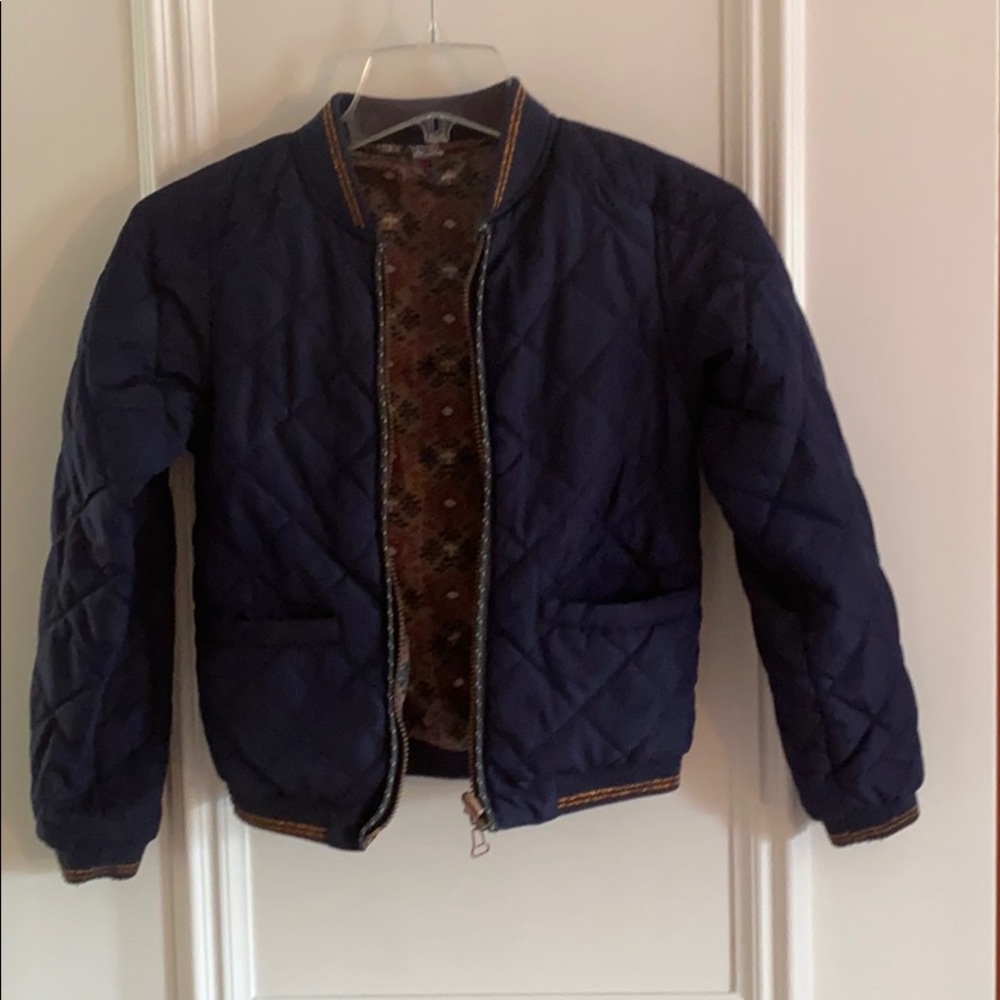 Girls blue reversible jacket.